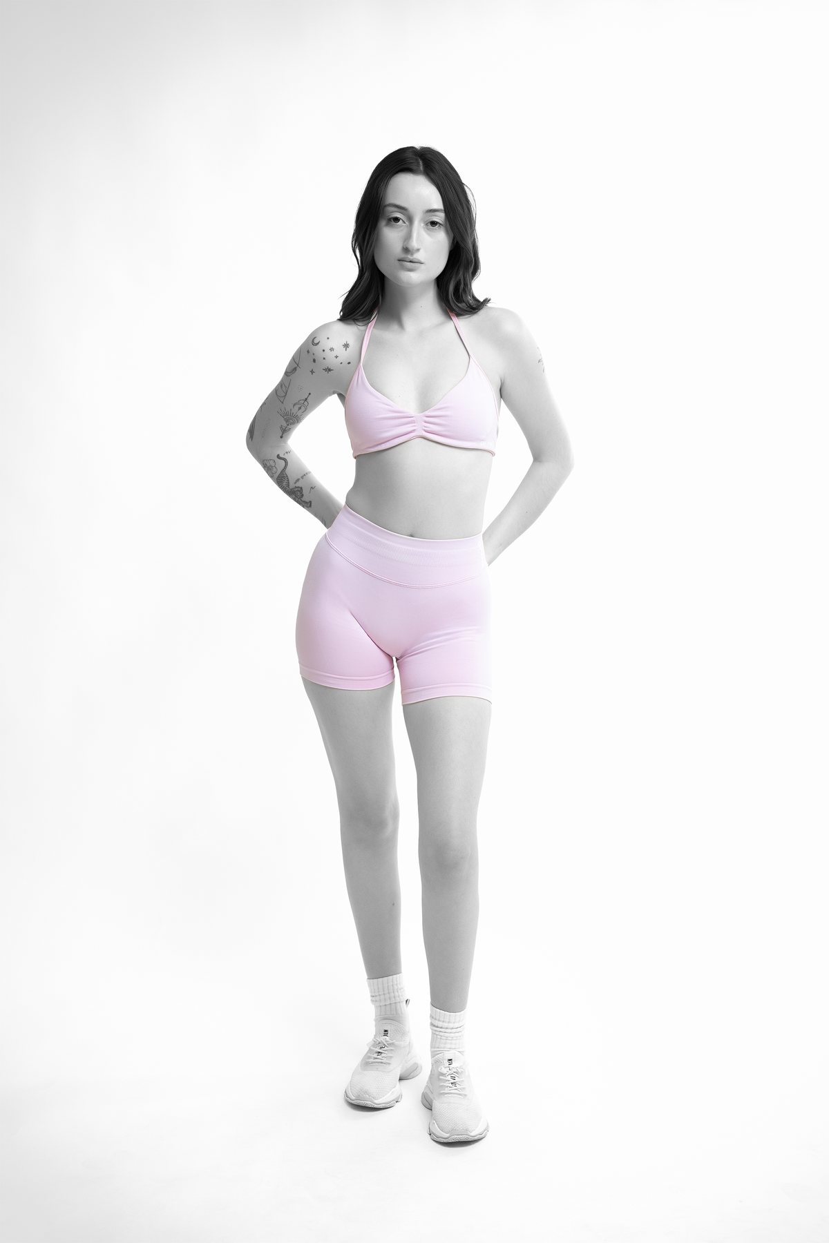 Activewear e-commerce frame — front-on full length in a pink sports bra and shorts, Melbourne