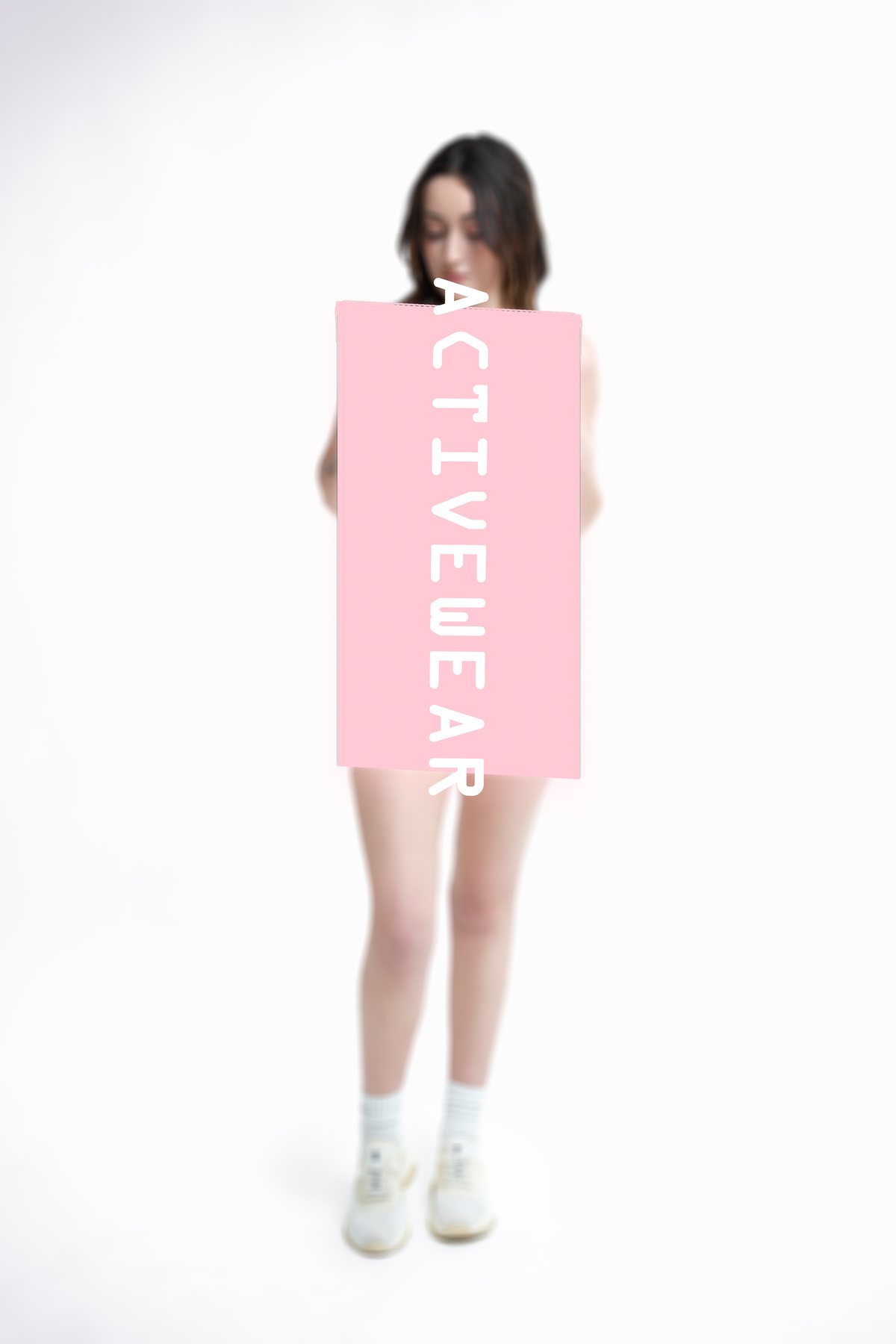 Activewear shoot cover — soft-focus model behind a pink ACTIVEWEAR title block, Namastey Melbourne