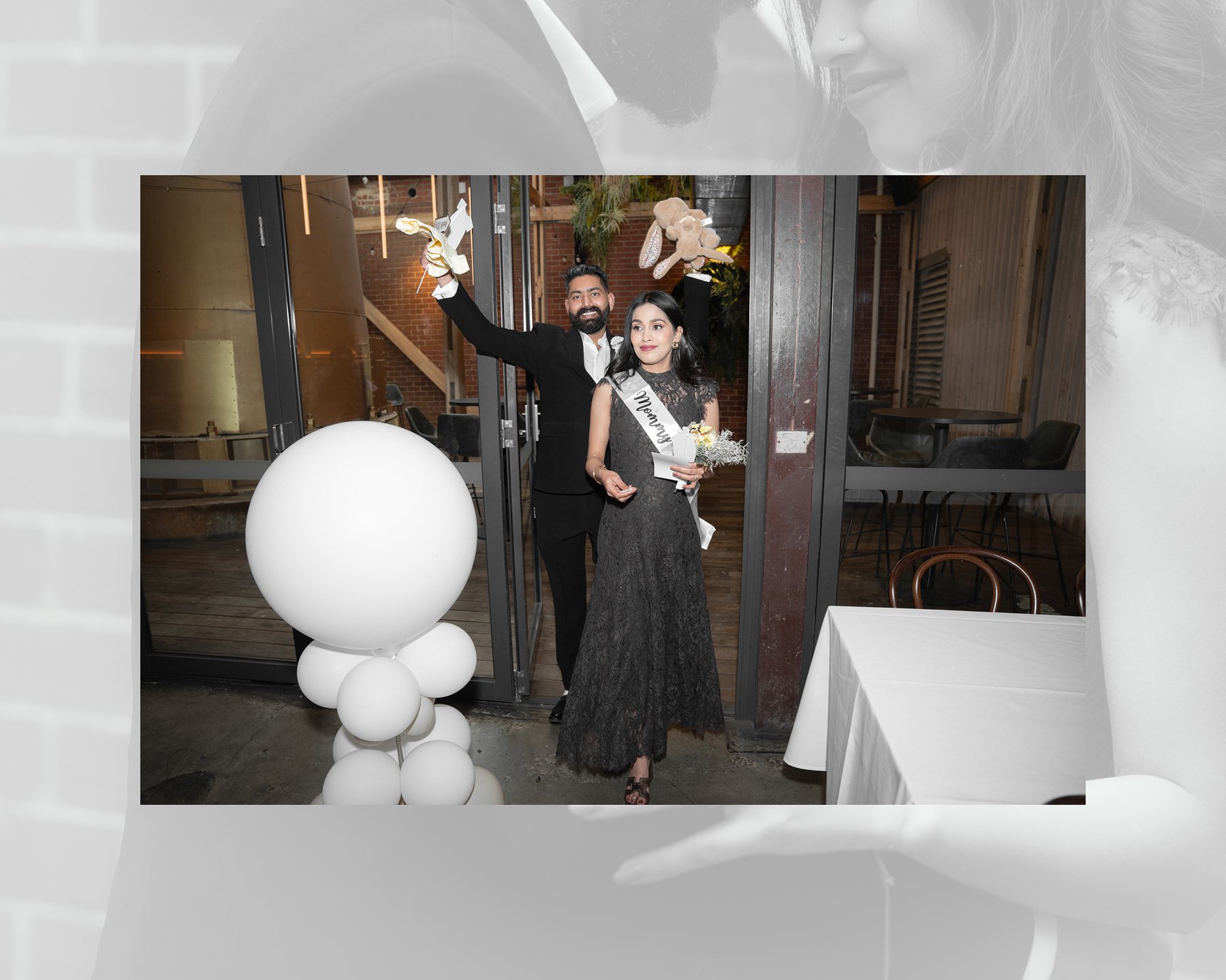 Baby shower spread — parents-to-be make their entrance past white balloons, Melbourne venue