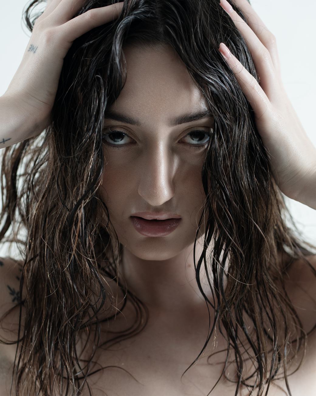 Studio fashion portrait — hands in hair, editorial close-up, Melbourne studio