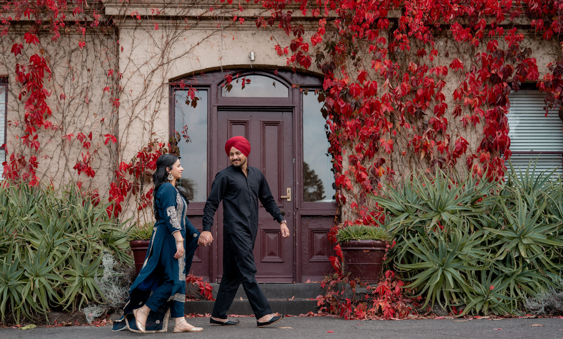 Gradient — couple walking together, autumn foliage, candid