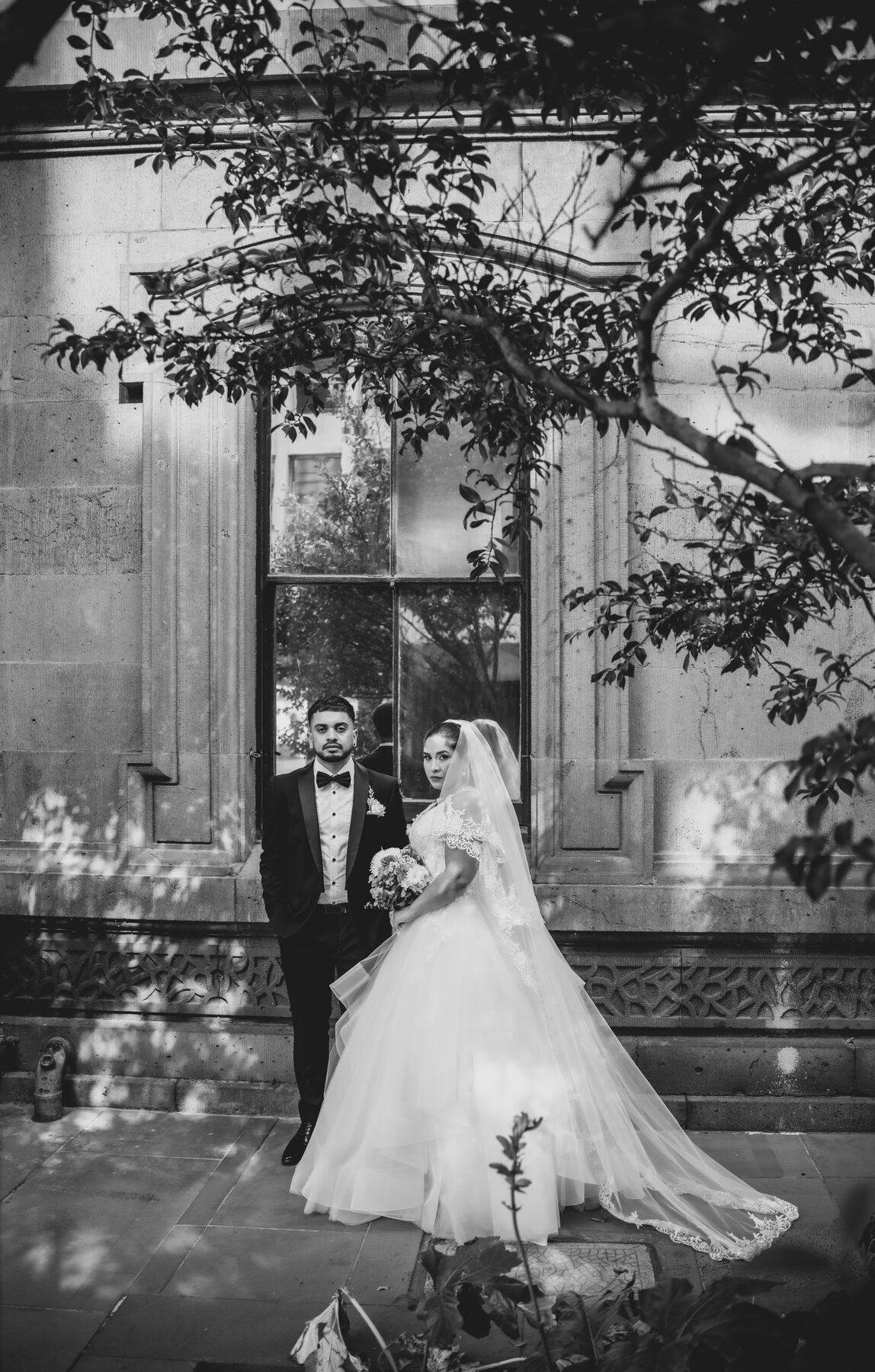 Gradient — B&W wedding, bride in full gown, heritage building Melbourne