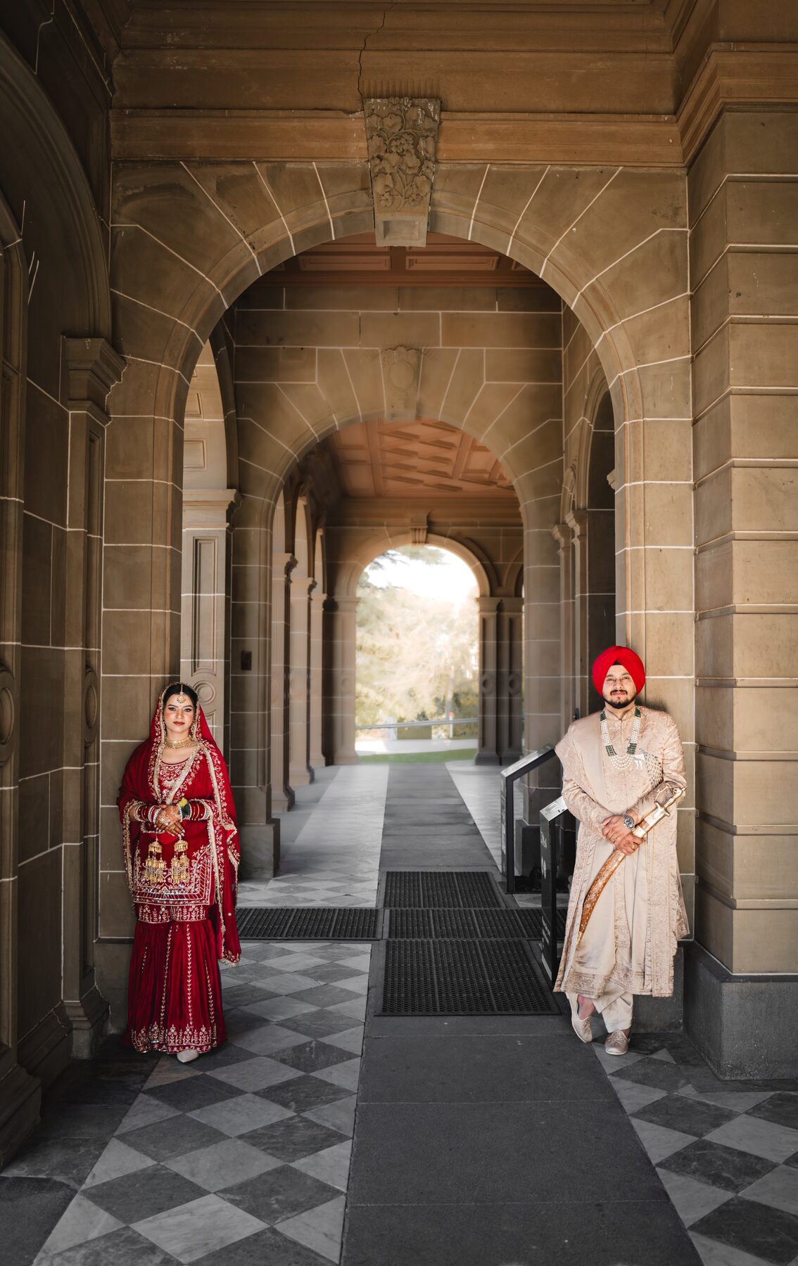 Gradient — bride framed in arched window shadow