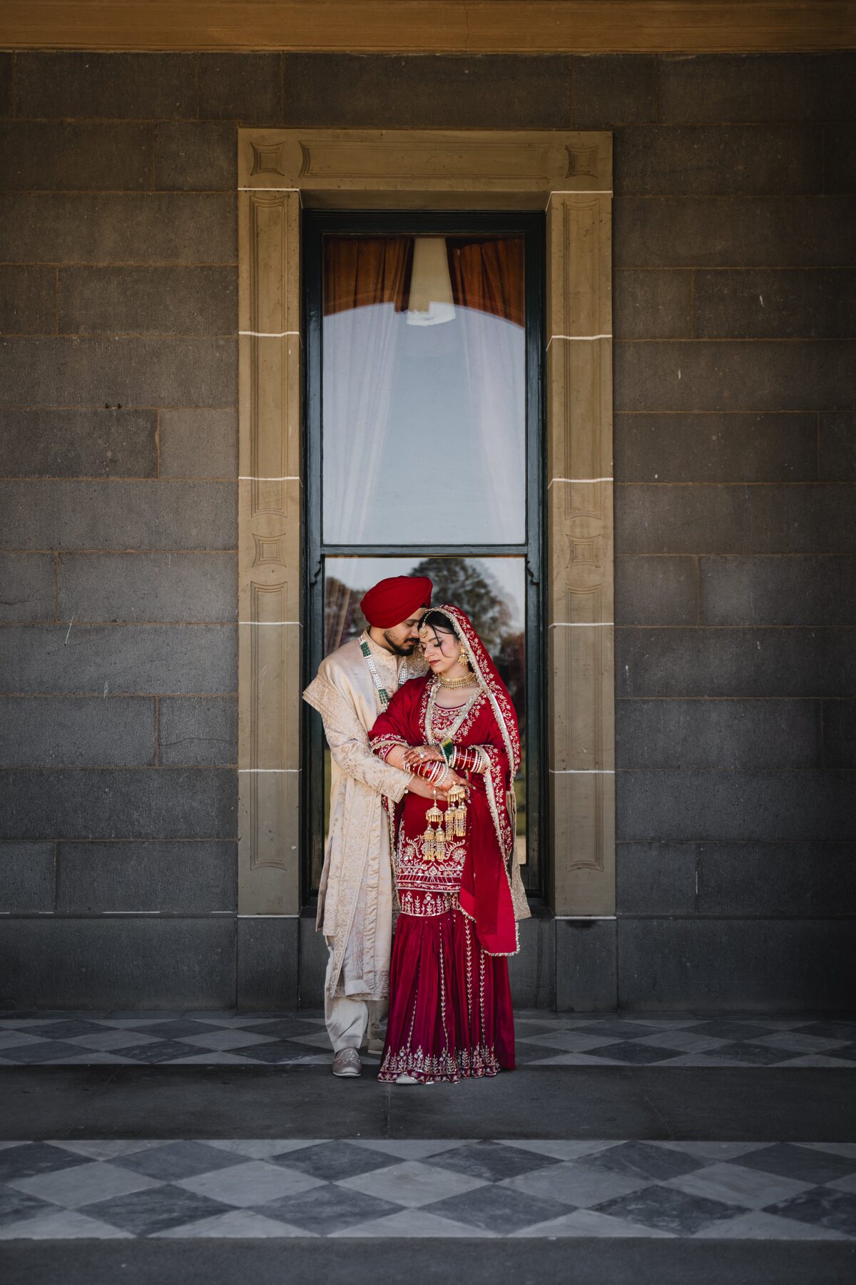 Gradient — couple in heritage doorway, romantic close portrait