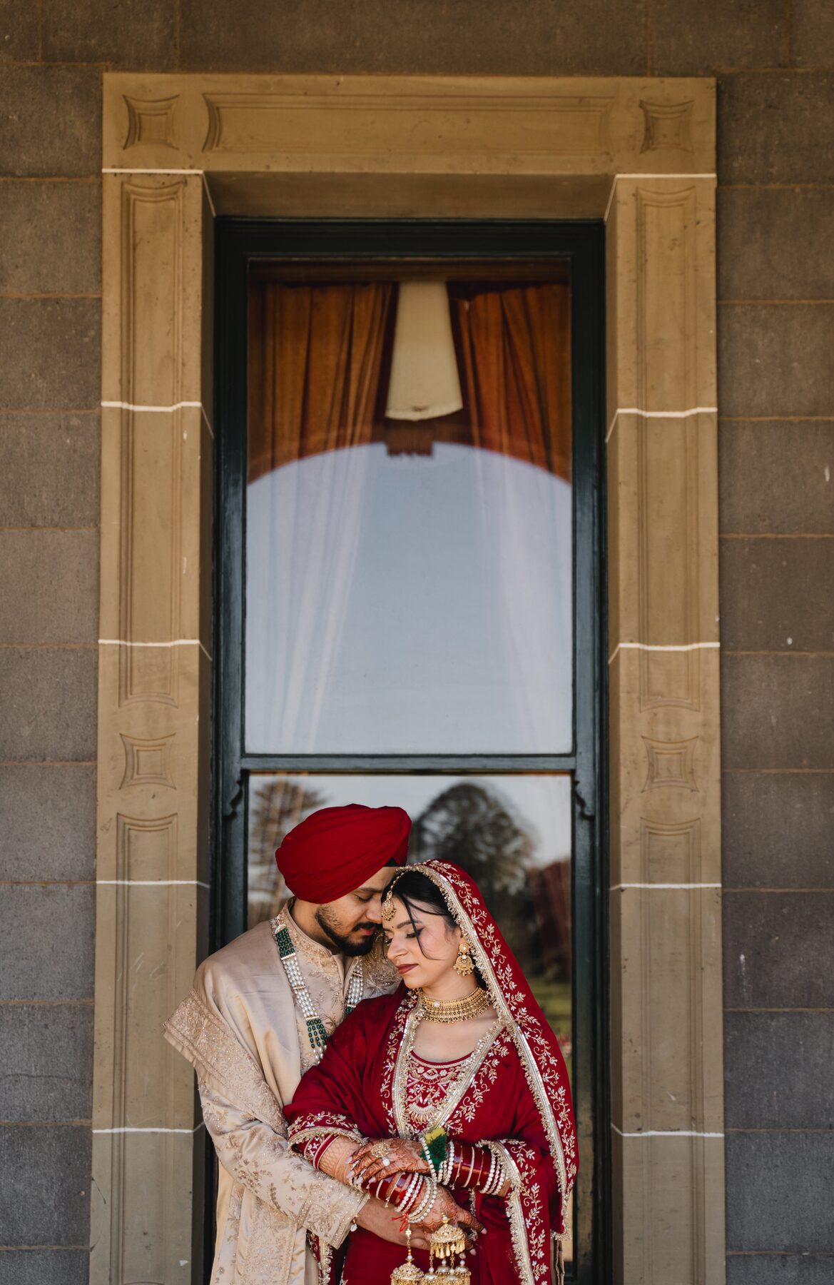 Gradient — intimate couple framed in heritage doorway