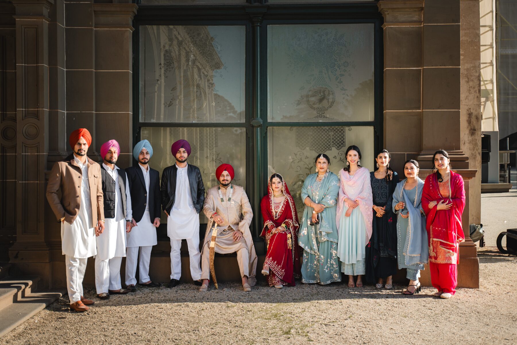 Gradient — Sikh wedding party group portrait, Melbourne heritage building