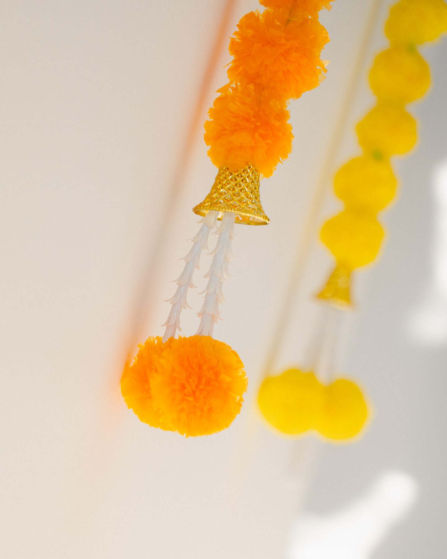 Marigold garlands in soft light — Griha Pravesh ceremony detail, Melbourne